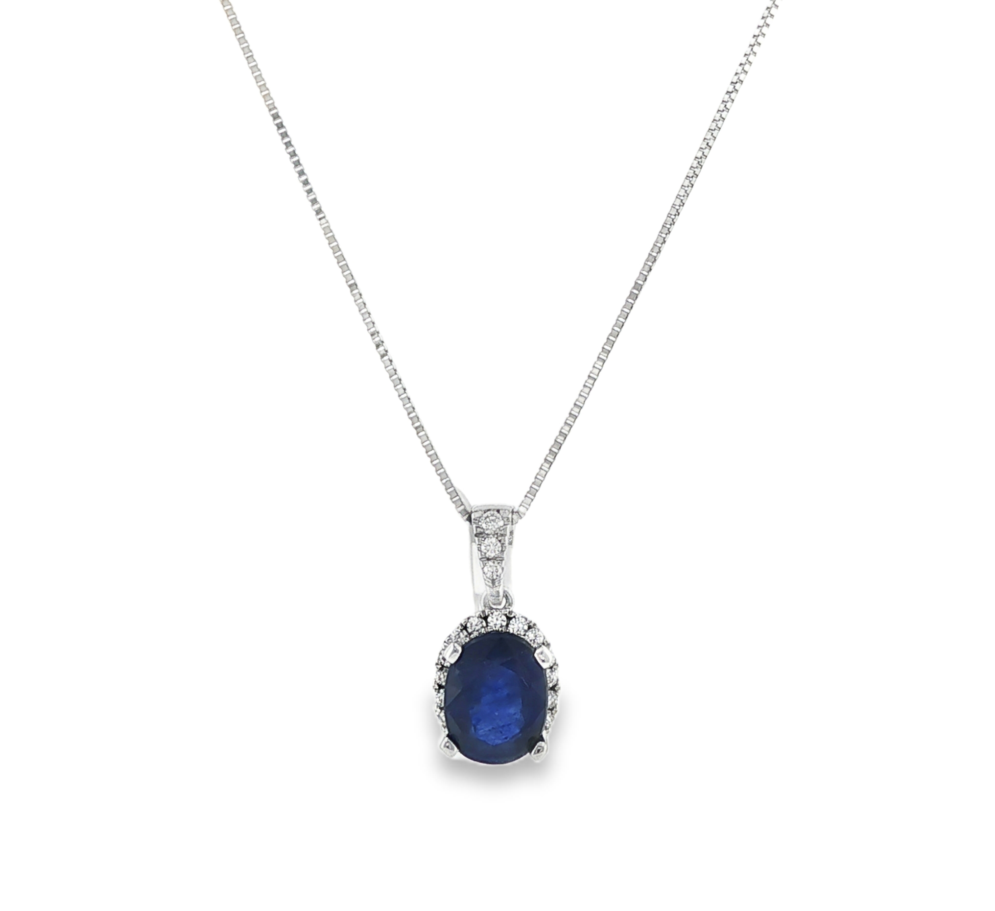 Sapphire and Diamond Halo pendant in 18K White Gold