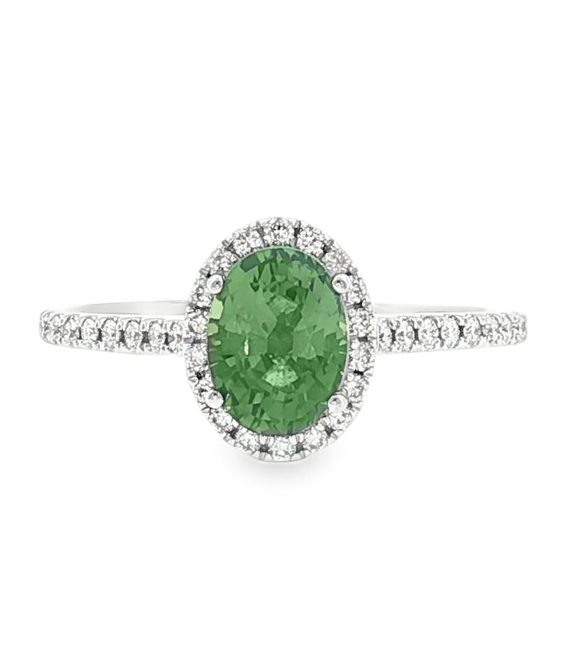 Oval green sapphire halo ring with diamond band in 18k white gold