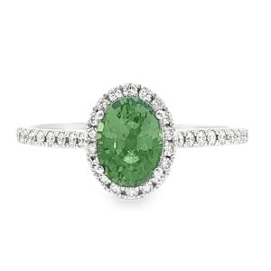 Oval green sapphire halo ring with diamond band in 18k white gold