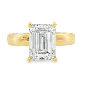 emerald cut solitaire engagement ring rith a lab grown diamond in 18k yellow gold